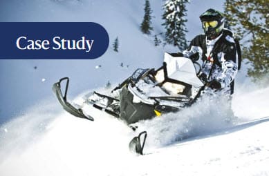 person driving a Polaris snowmobile in snow with "Case Study" as heading